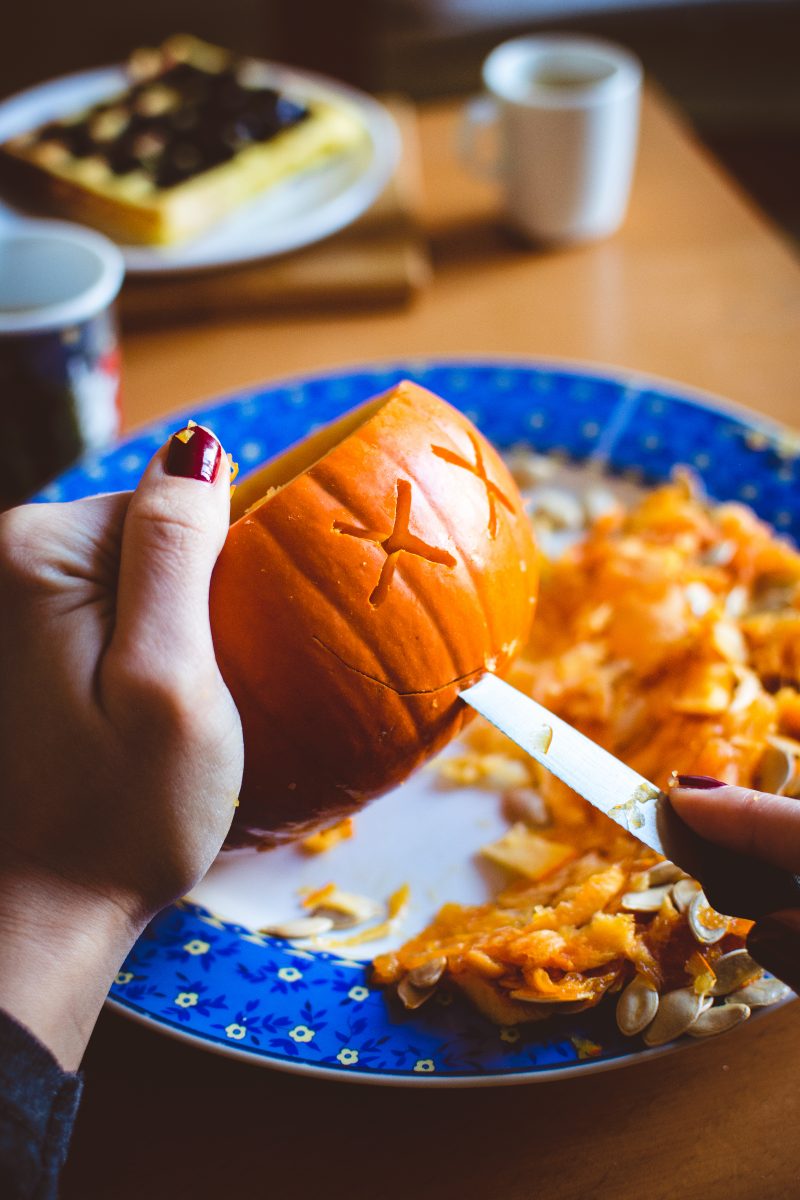 Carving Halloween pumpkin