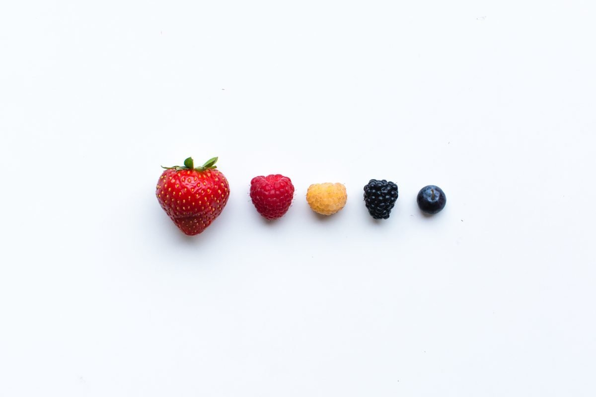 Colorful fresh berries on a white background