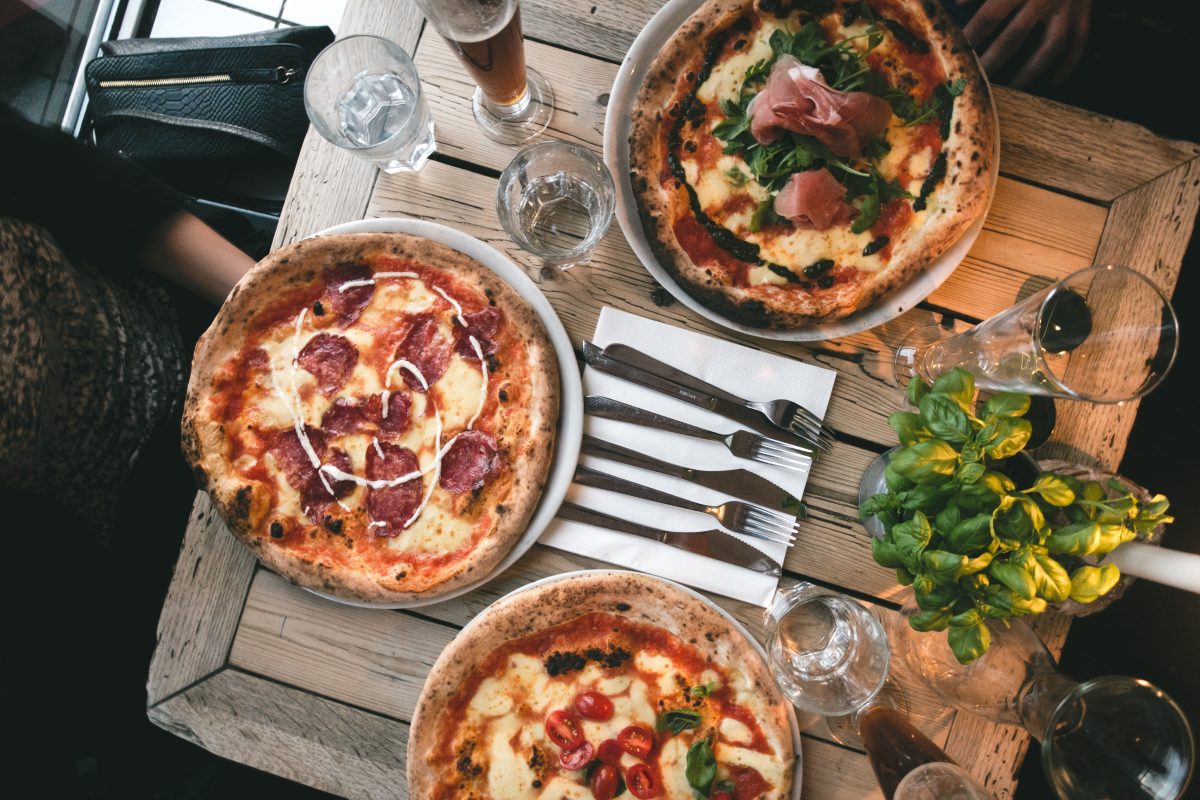 Friends having pizza in a restaurant