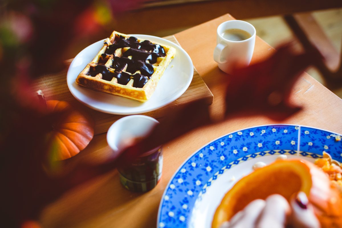 Homemade pumpkin waffle with dark chocolate topping