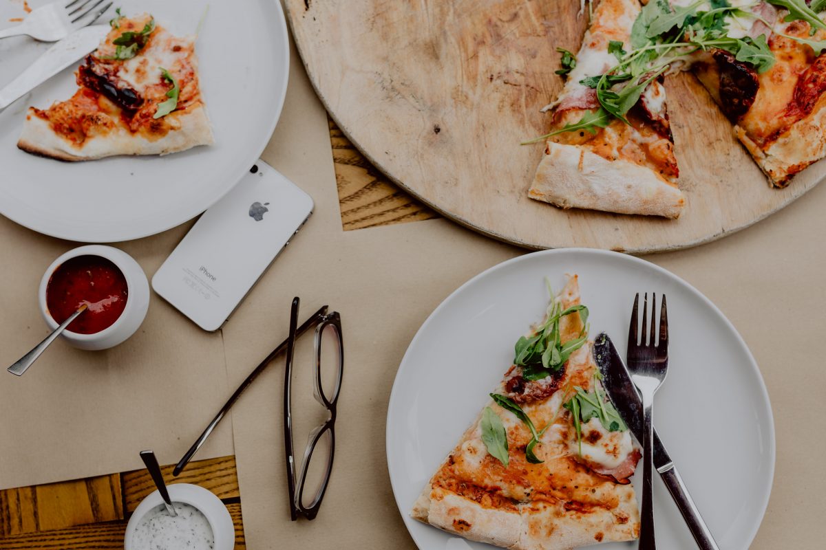 Slice of pizza with rocket leaf