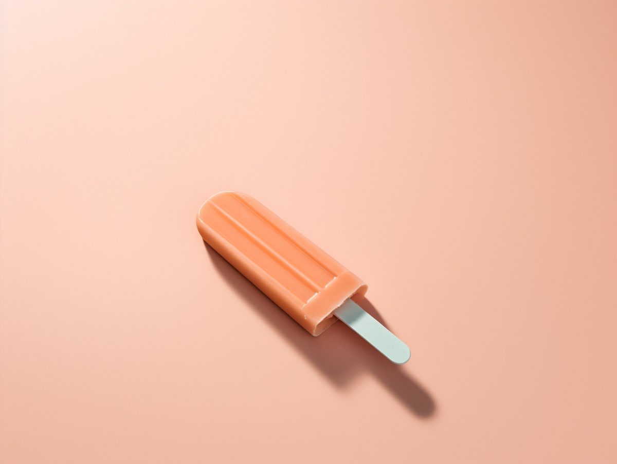 Orange popsicle on orange background