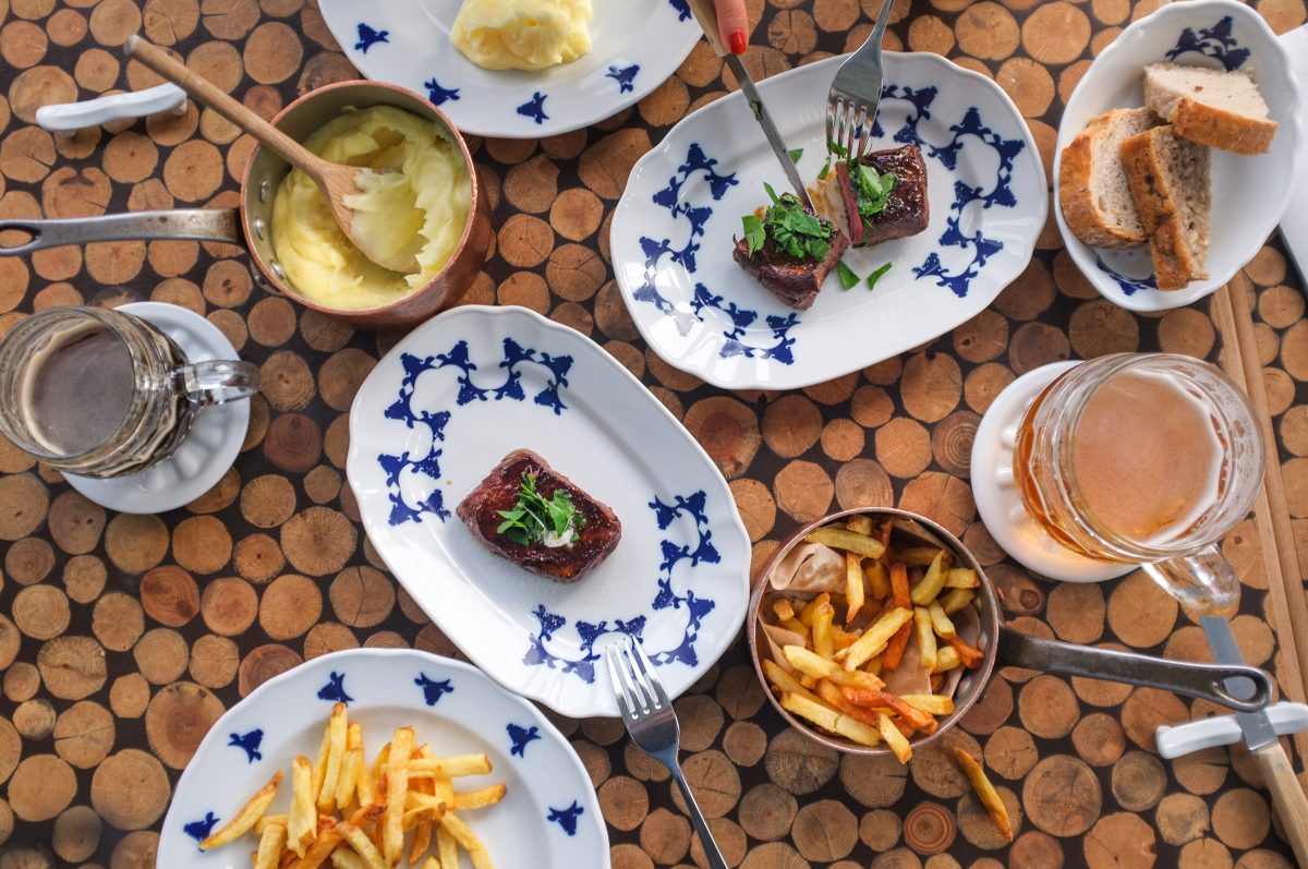 Table full of food in a steakhouse