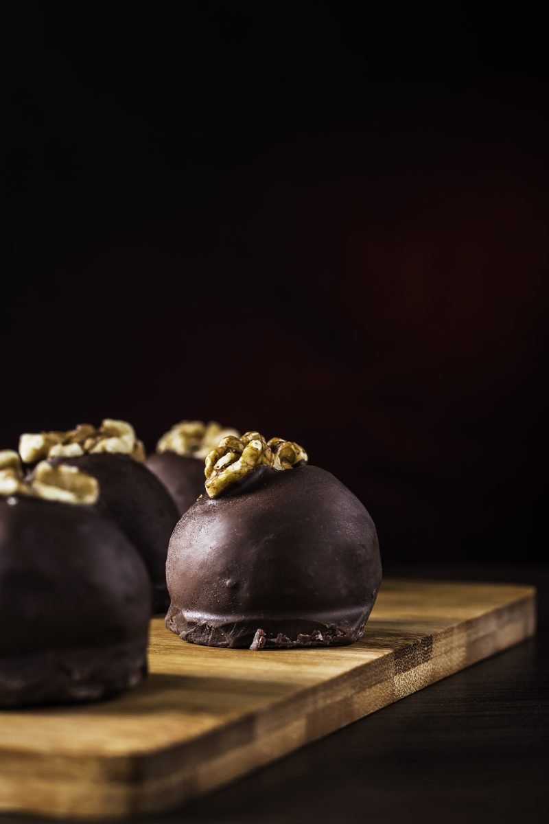 Chocolate truffles with walnuts close up